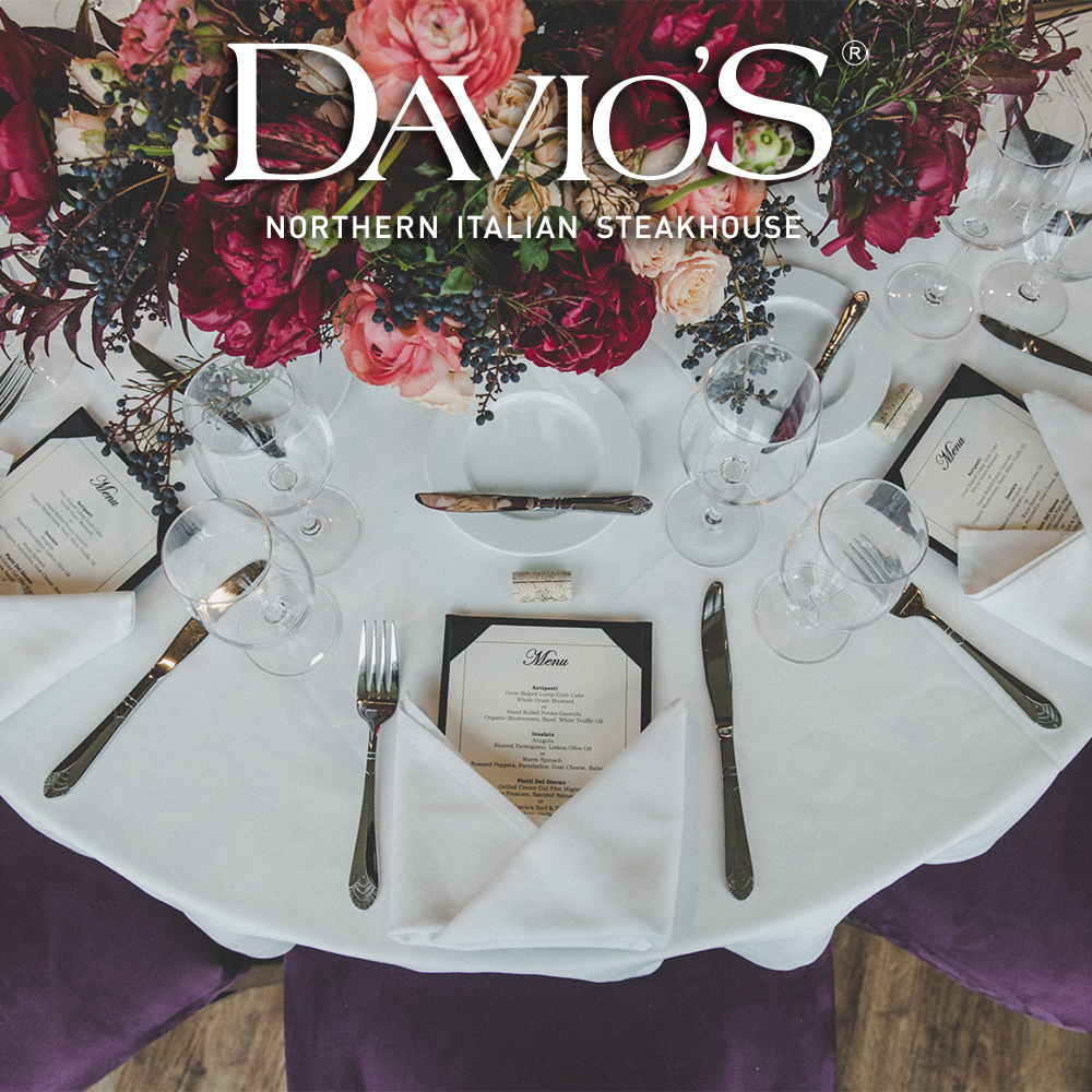 Davios Private Events Dining round table with place setting and floral centerpiece